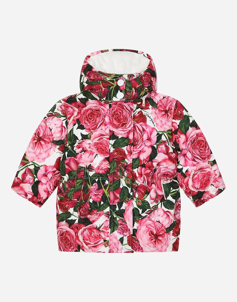 Short nylon down jacket with rose print over a white background