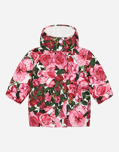 Short nylon down jacket with rose print over a white background