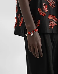 Metal bracelet with coral details and logo