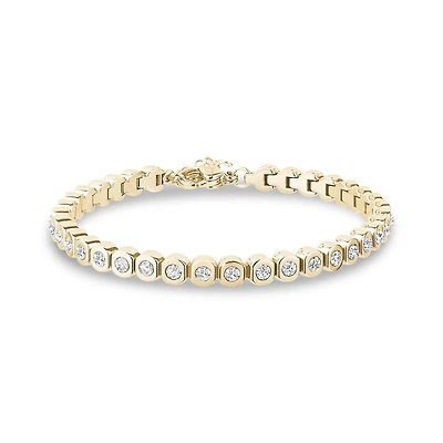 Gold Tone Stainless Steel Bezel Set Tennis Bracelet. Color: yellow | Doucet Latendresse