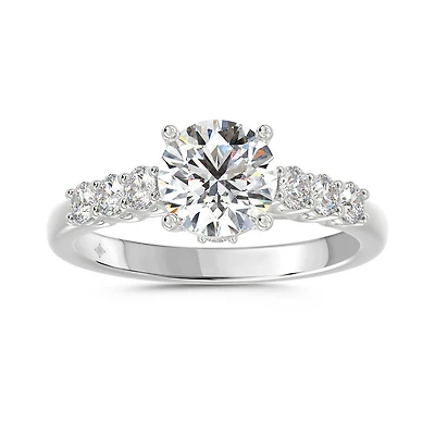 14K White Gold Round Lab Diamond Engagement Ring with Graduated Side Stones. Color: white | Doucet Latendresse