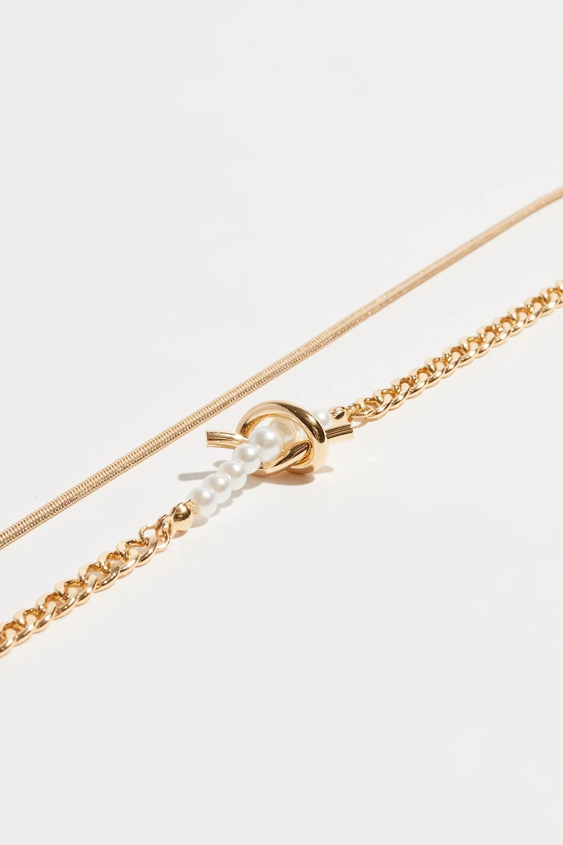 Collier superposé avec nœud et perles
