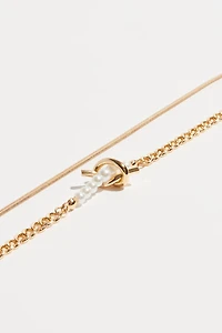 Collier superposé avec nœud et perles