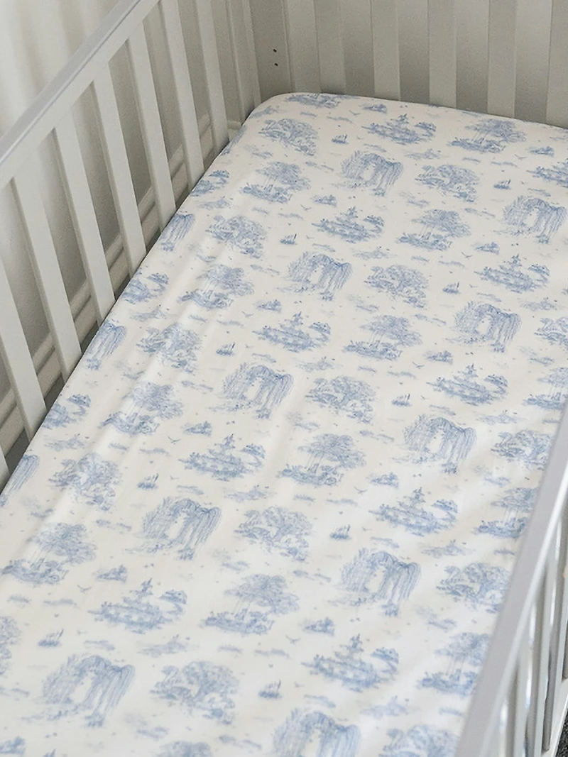 The Gilded Bird Spring Toile Blue Fitted Crib Sheet