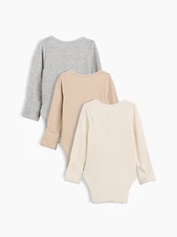 Cache-couche finement côtelé à poche Premiers essentiels pour béb