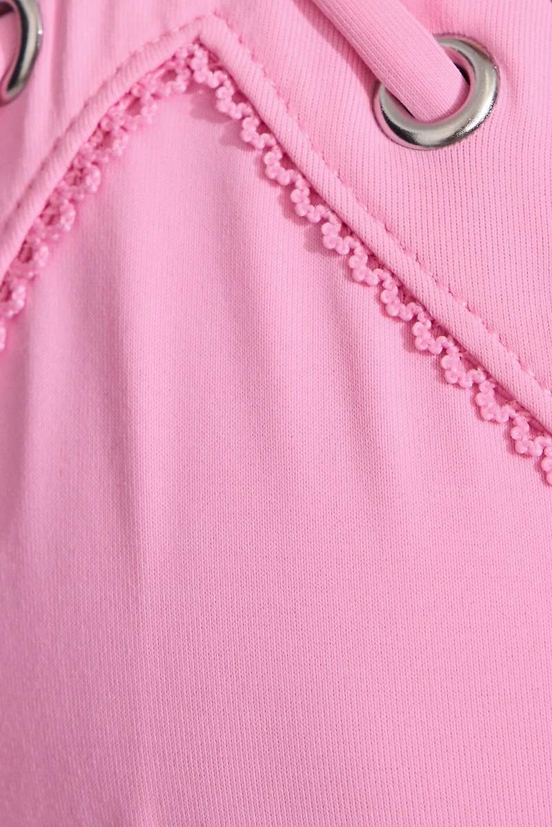 Bas de bikini brésilien avec cordons sur le côt