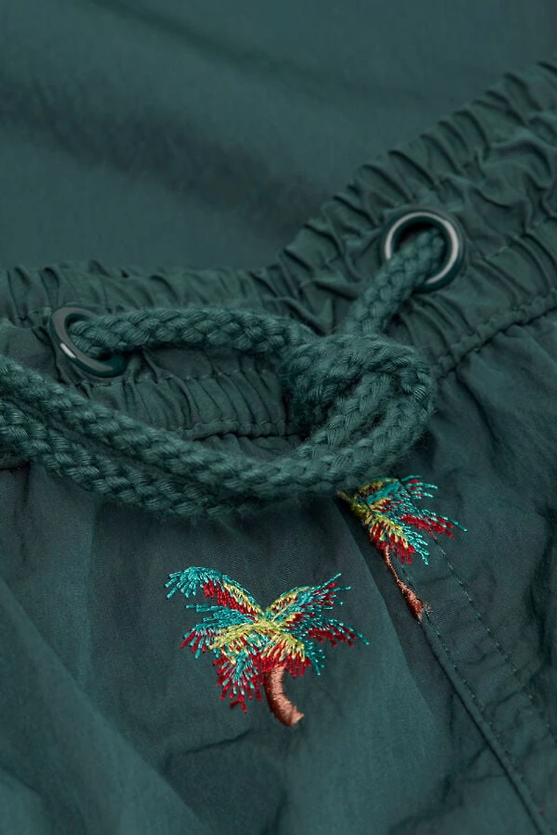 Embroidered Palm Tree Swim Trunks