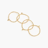 Tiny gold stretch bracelets pack-of-four