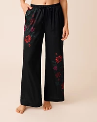 Pantalon en satin imprimé roses rouges