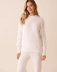 Chandail en tricot manches longues torsadées