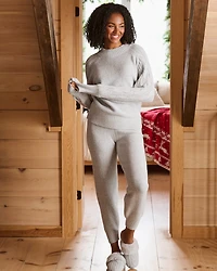 Pantoufles en tricot torsadé et fausse fourrure