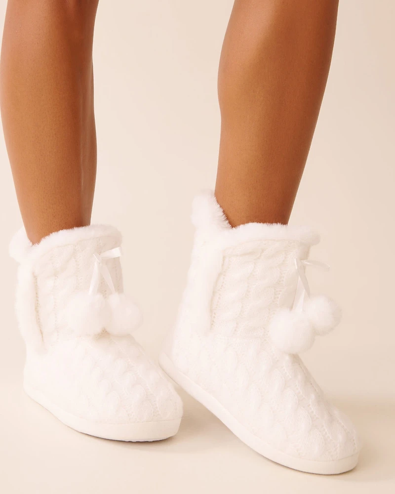 Pantoufles bottines effet tricoté à pompons