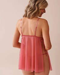 Babydoll en dentelle et résille à nouer sur les côtés