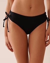 Bas de bikini brésilien liens croisés côtelé en fibres recyclées SOLID