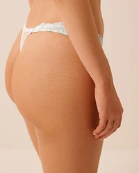 Culotte tanga échancrée en résille brodée