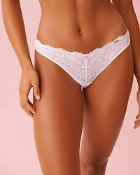 Culotte tanga en dentelle avec jarretelles