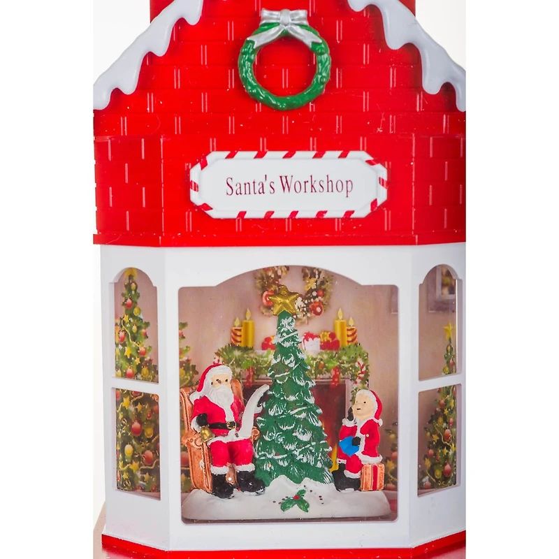 Boule à neige suspendu en plastique rouge atelier du Père Noël avec DEL et paillettes