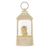 Lanterne musicale en plastique blanc avec Boule à neige DEL ange paisible et paillettes
