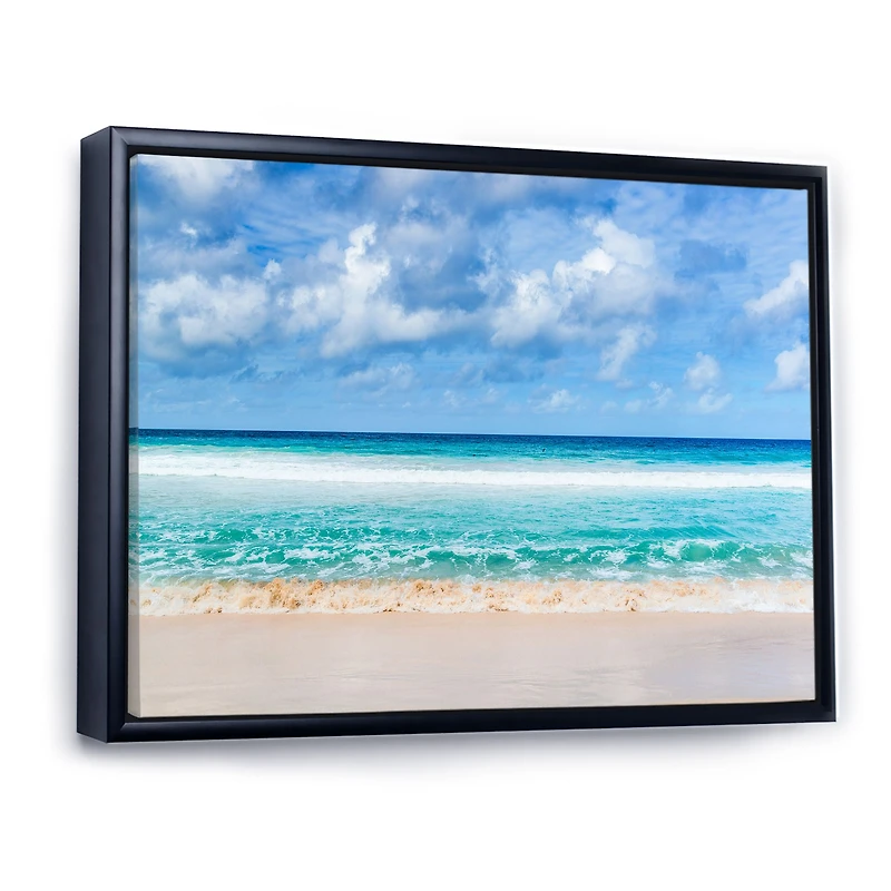 Tranquil Beach Under White Clouds  Canvas Artwork
