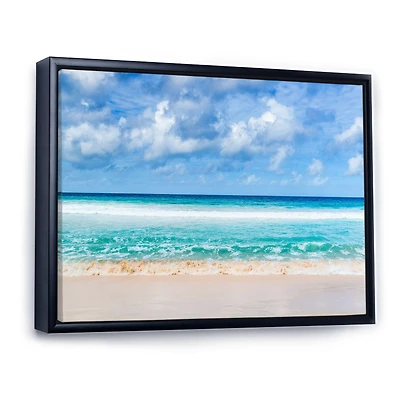 Tranquil Beach Under White Clouds  Canvas Artwork