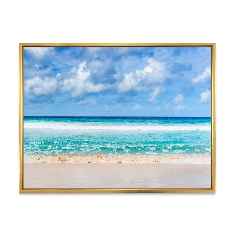 Tranquil Beach Under White Clouds  Canvas Artwork