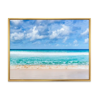 Tranquil Beach Under White Clouds  Canvas Artwork