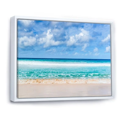 Tranquil Beach Under White Clouds  Canvas Artwork