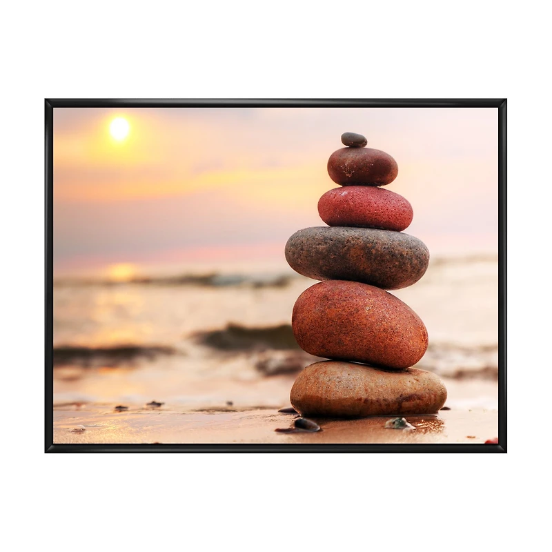 Toile « Stones Pyramid on Sand Symbolizing Zen »