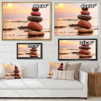 Toile « Stones Pyramid on Sand Symbolizing Zen »