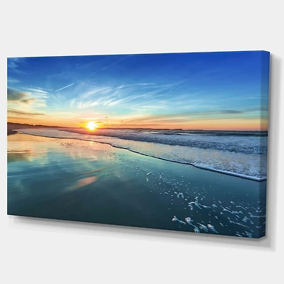 Blue Seashore with Distant Sunset Canvas Wall Art