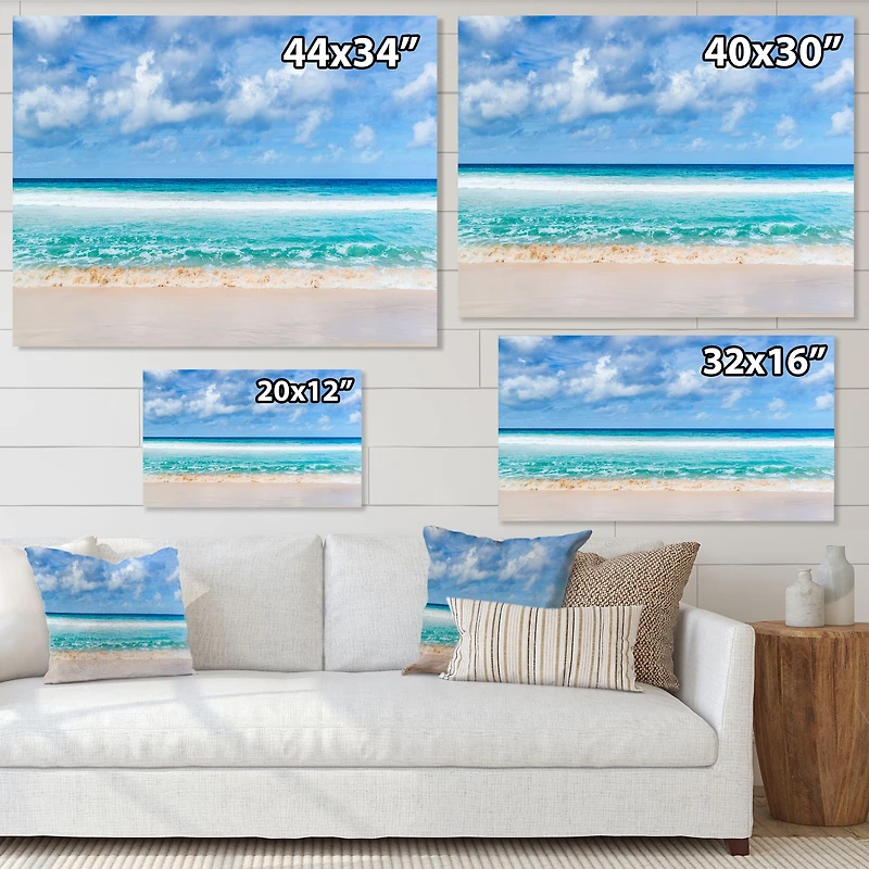 Tranquil Beach Under White Clouds  Canvas Artwork