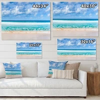 Tranquil Beach Under White Clouds  Canvas Artwork