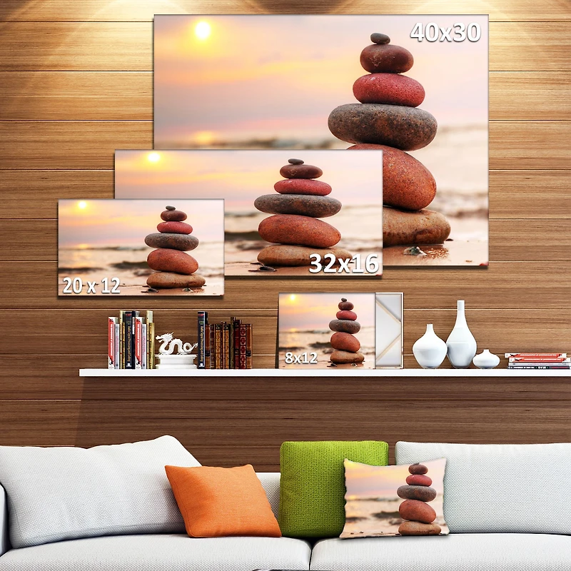 Toile « Stones Pyramid on Sand Symbolizing Zen »