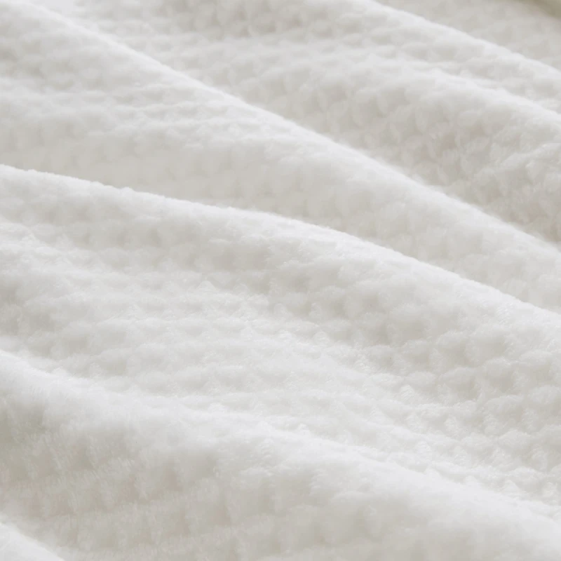 Couverture en peluche à texture gaufreé