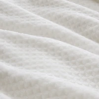 Couverture en peluche à texture gaufreé