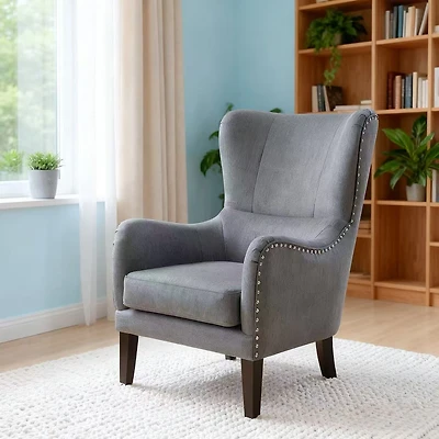 Fauteuil à dossier haut clouté – gris