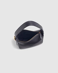 The Sculpted Metal Wristlet Bag