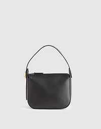 The Sculpted Metal Wristlet Bag
