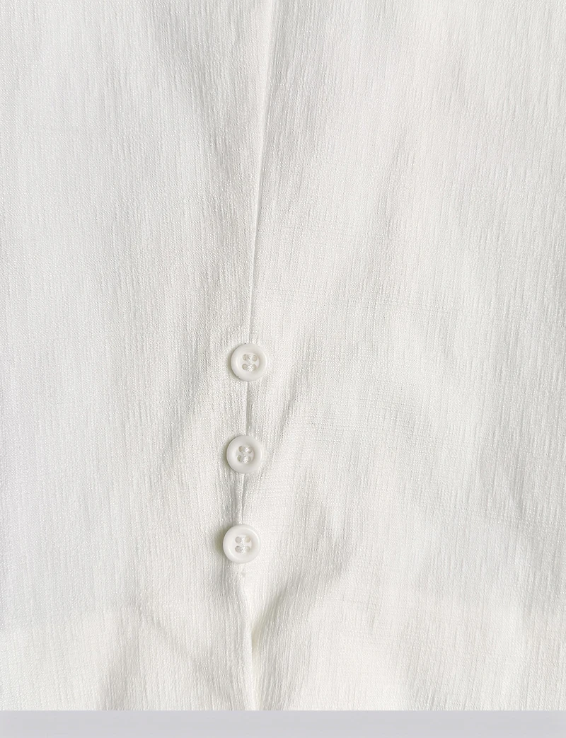 Capri Blanc Coupe Ajustée Extensible avec Deux Poches et Ourlet Boutonné