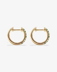 Boucles d'oreilles Huggie avec émeraude en or jaune 10 carats