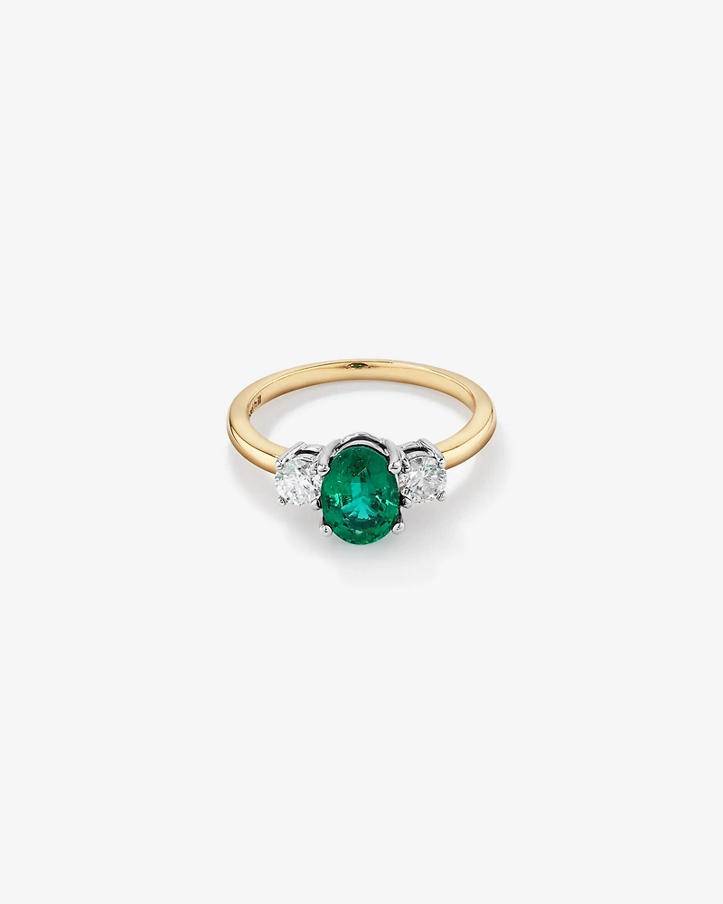 Bague en or blanc et jaune 14 K avec émeraude et diamants totalisant 0,40 ct