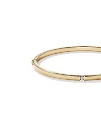 Jonc ovale accentué de diamants en or jaune 10kt