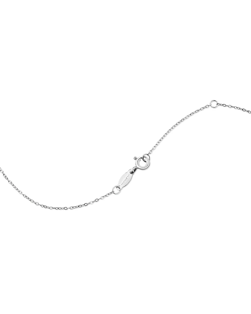 Bague en or blanc 10 K avec rubis et diamants totalisant 0,14 ct