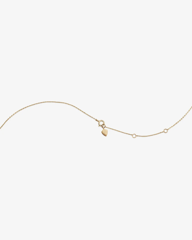Collier à cœur miniature bombé en or jaune 10 K et rhodium avec diamants totalisant 0,12 ct