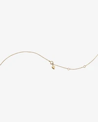 Collier à cœur miniature bombé en or jaune 10 K et rhodium avec diamants totalisant 0,12 ct