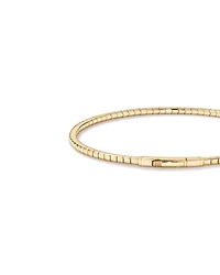 Bracelet flexible ovale avec diamants totalisant 0.35 carat et pierres précieuses saphir bleu en or jaune 10 carats