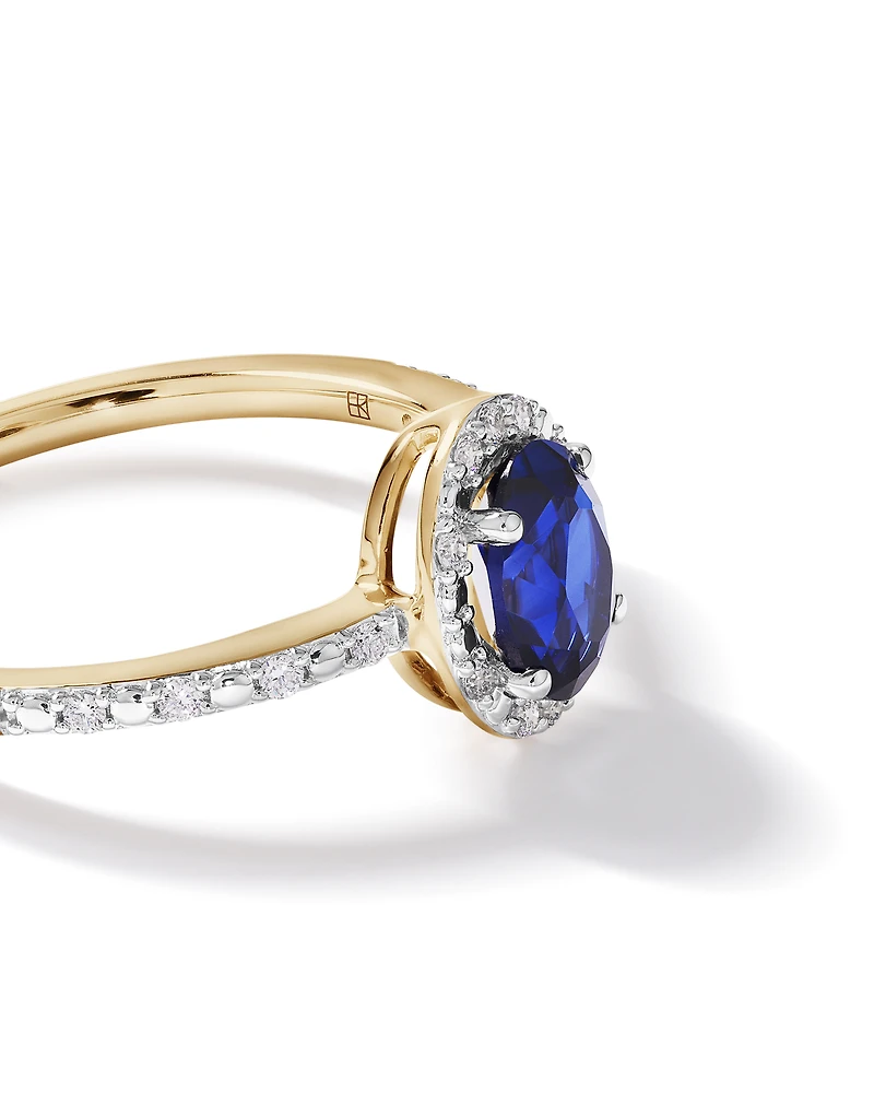 Oval Cut Blue Created Sapphire and Lab-Grown Diamond Halo Ring in 10kt Yellow Gold and Rhodium