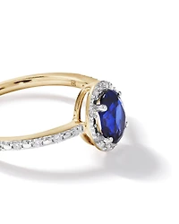 Oval Cut Blue Created Sapphire and Lab-Grown Diamond Halo Ring in 10kt Yellow Gold and Rhodium