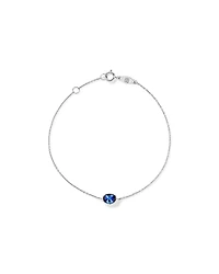 Oval Blue Created Sapphire Bezel Bracelet in 10kt White Gold