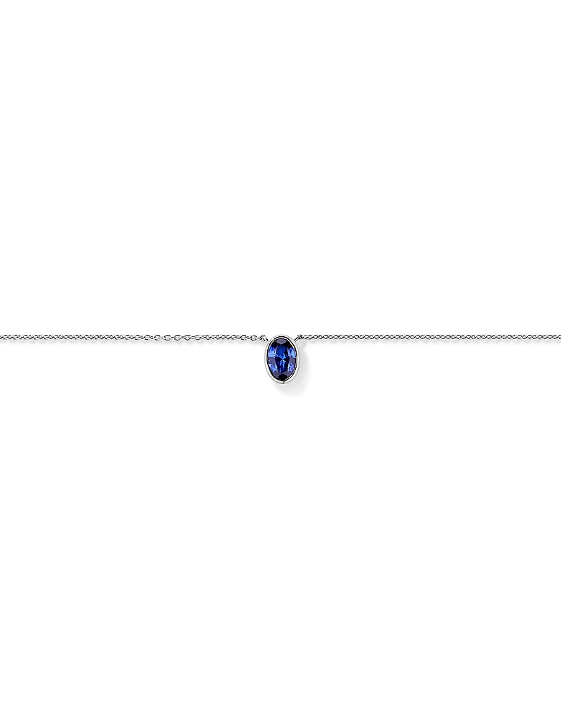 Oval Blue Created Sapphire Bezel Necklace in 10kt White Gold